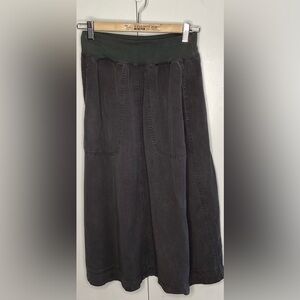 Cut loose small grey cotton A=line skirt with pockets.